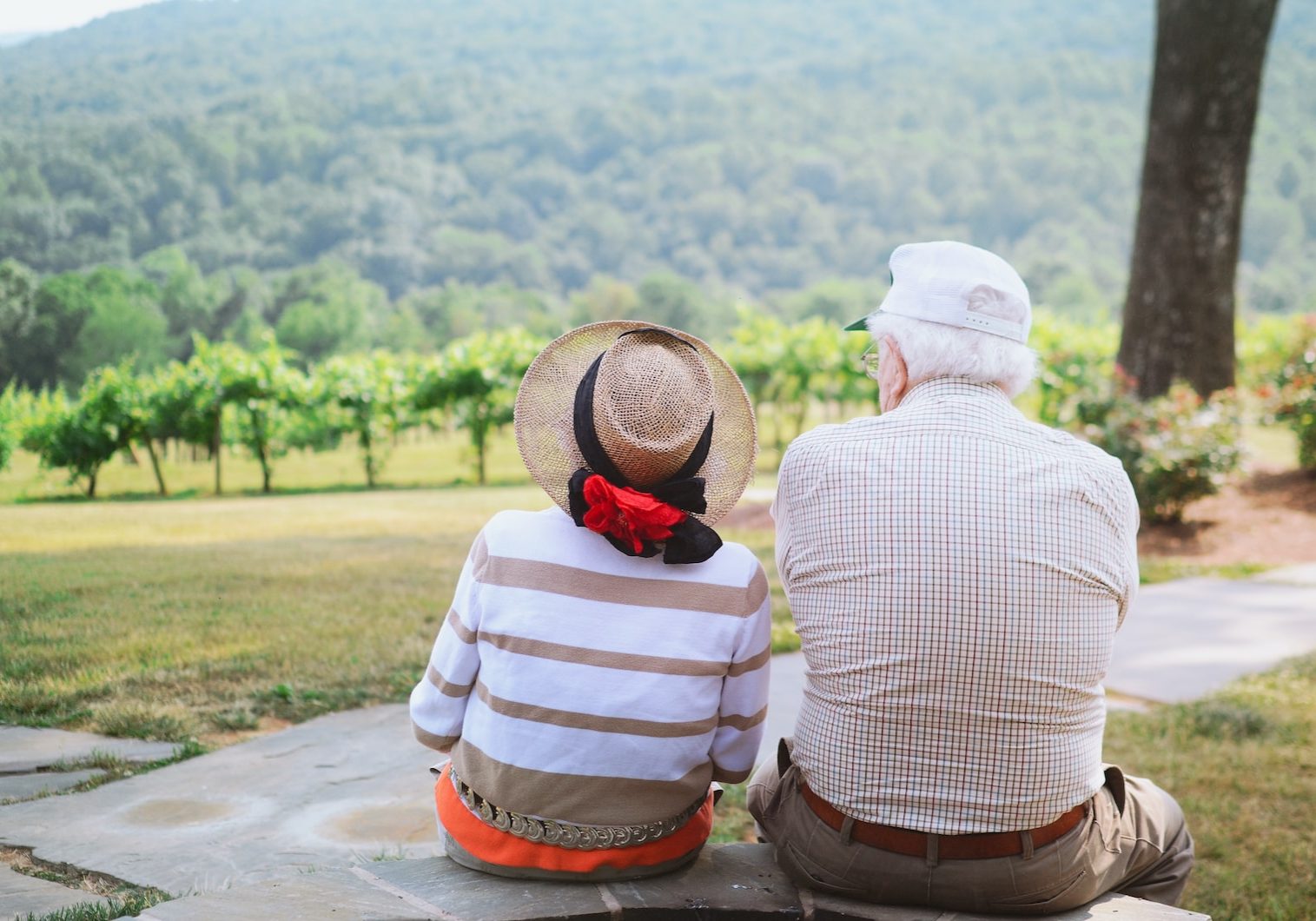 couple sitting on pathway